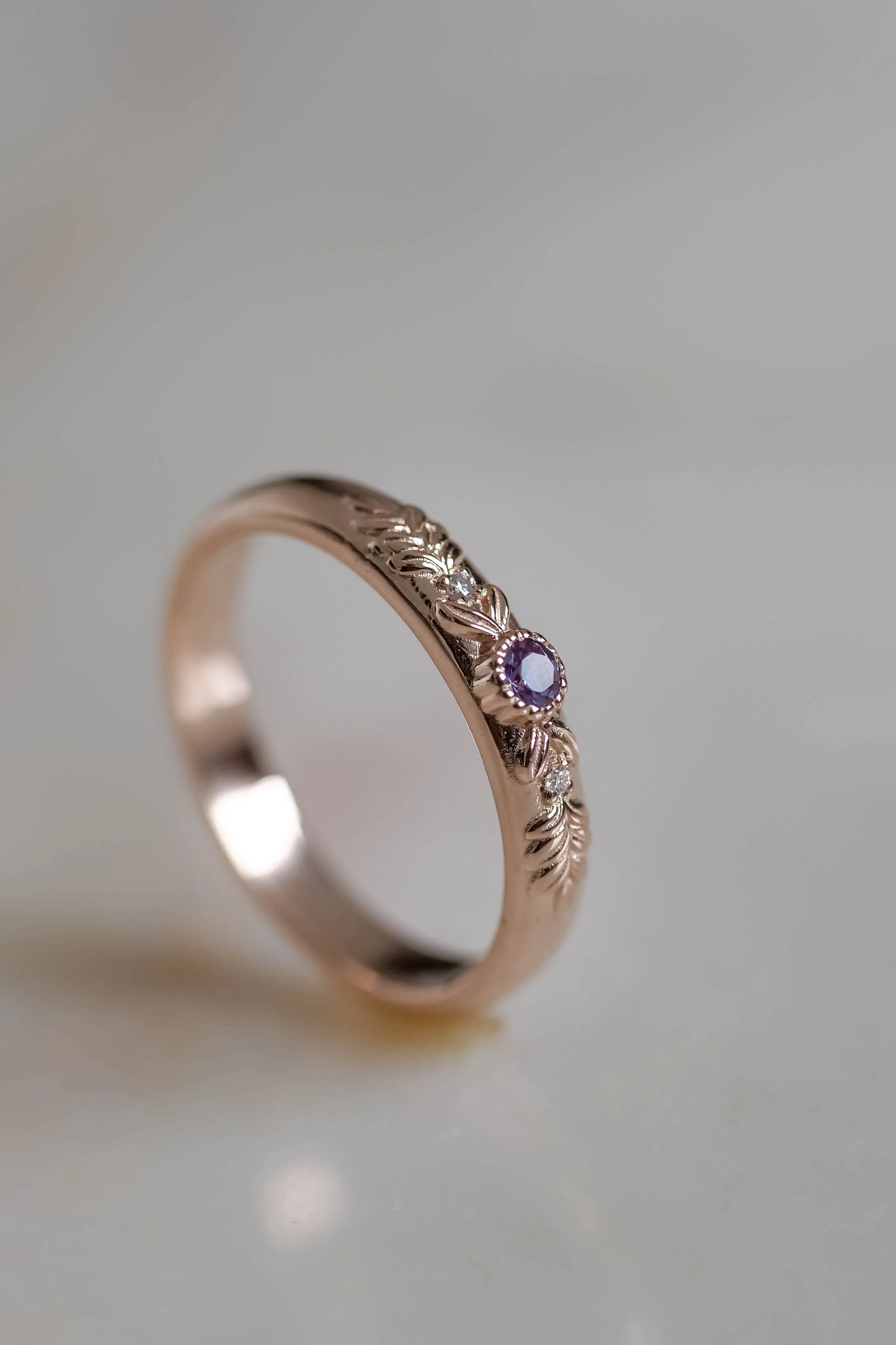 Wreath wedding band with three gemstones