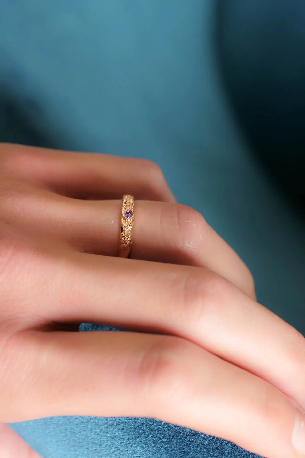 Wreath wedding band with three gemstones
