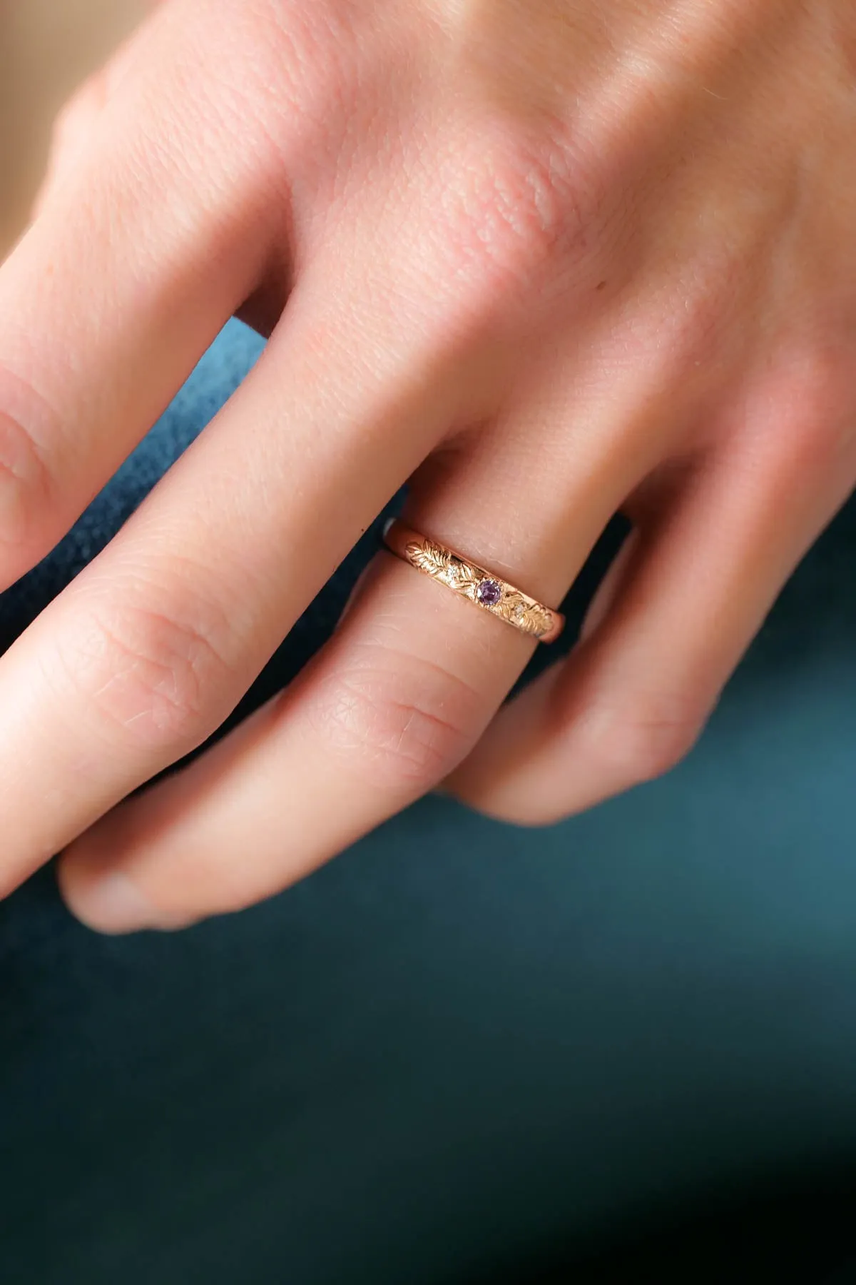 Wreath wedding band with three gemstones